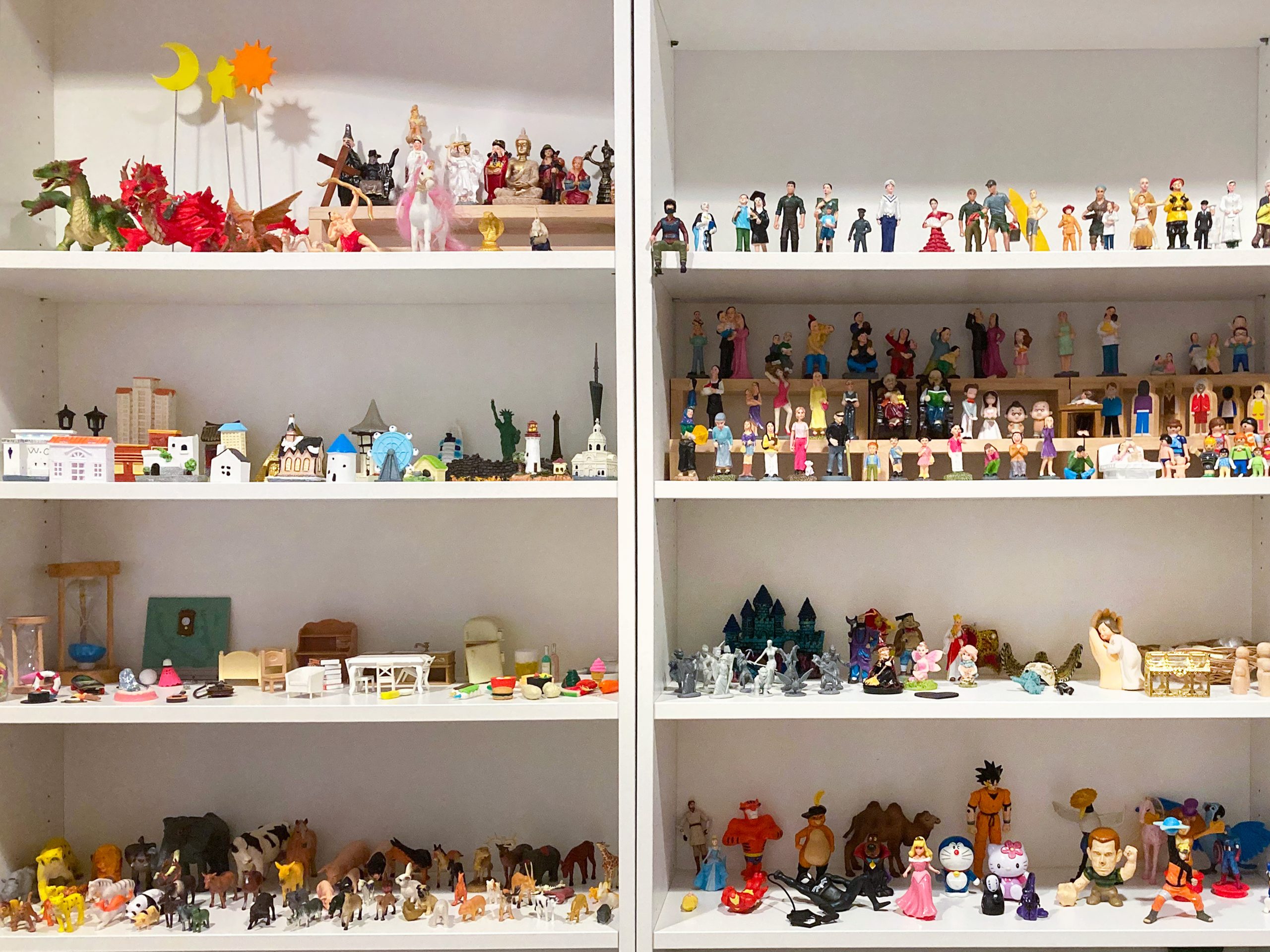 Shelves of miniature figures and play therapy tools used in counselling sessions