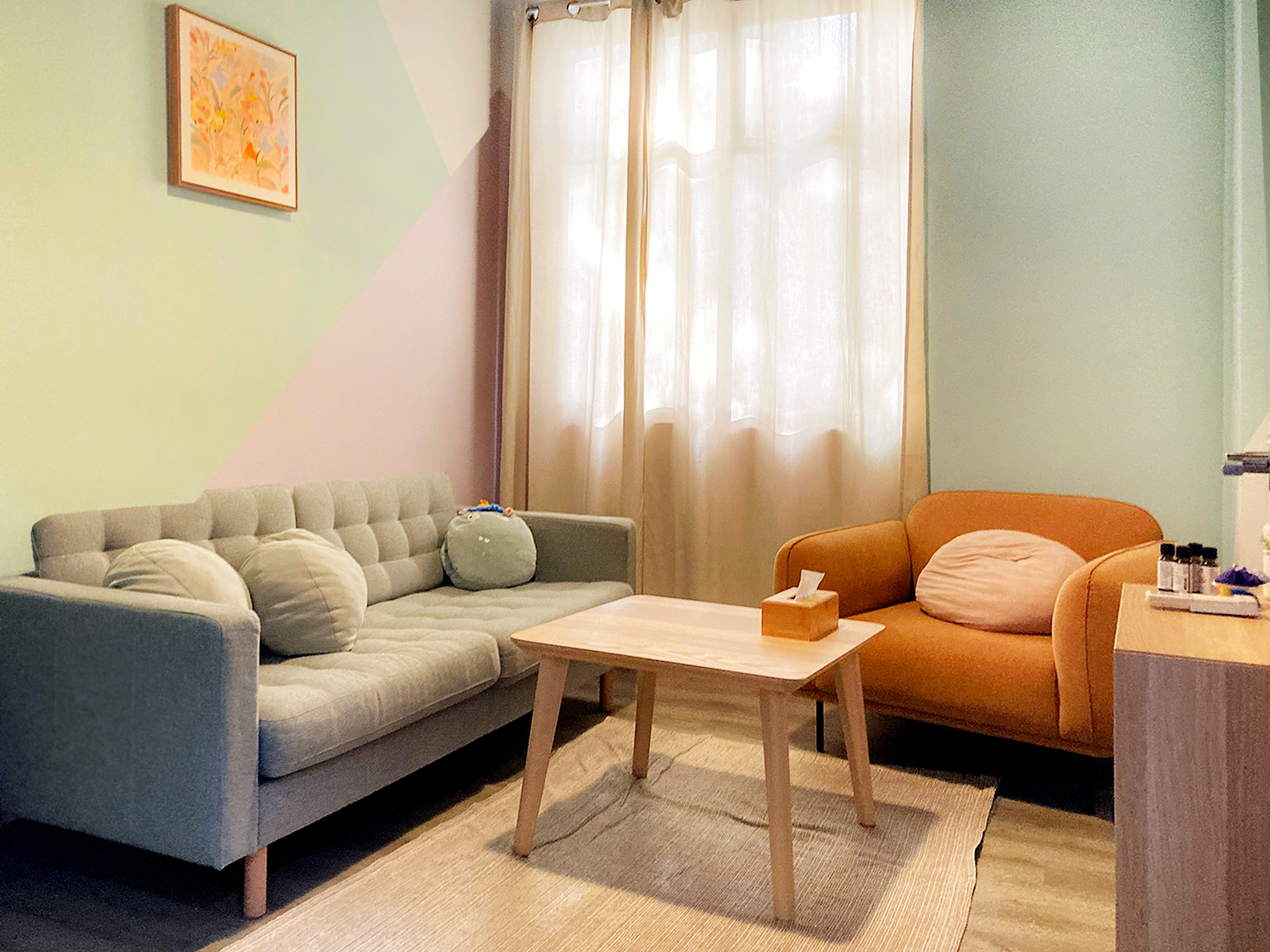 Counselling room at Trybe’s Tampines location with sofas and a small table
